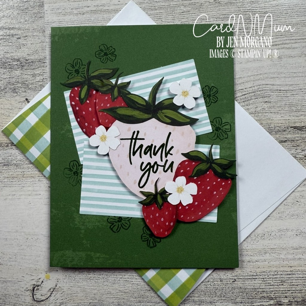 A thank you card featuring strawberries and flowers on a green background, with a striped design in the backdrop.