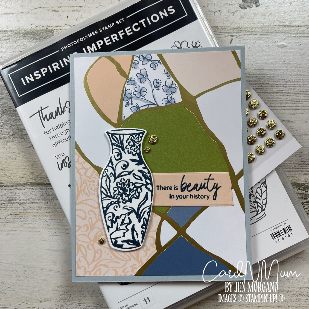 A handmade greeting card featuring a decorative vase, a motivational message reading 'There is beauty in your history', and an assortment of colorful geometric shapes in the background, alongside a set of embellishments.