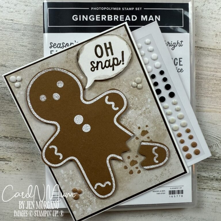 A handmade card featuring a gingerbread man with a missing piece, accompanied by a speech bubble saying 'OH snap!' and various decorative embellishments.