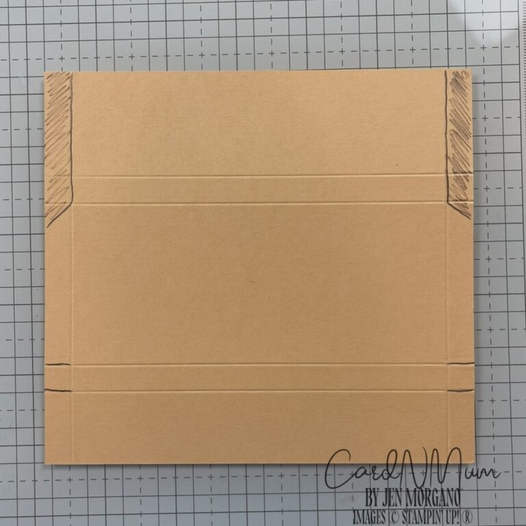 A cut and scored piece of brown cardstock, showing guide lines for creating a holder for a full-size Hershey bar.