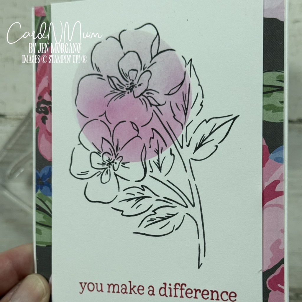 A handmade card featuring a large floral illustration with soft purple shading and the text 'you make a difference' at the bottom.