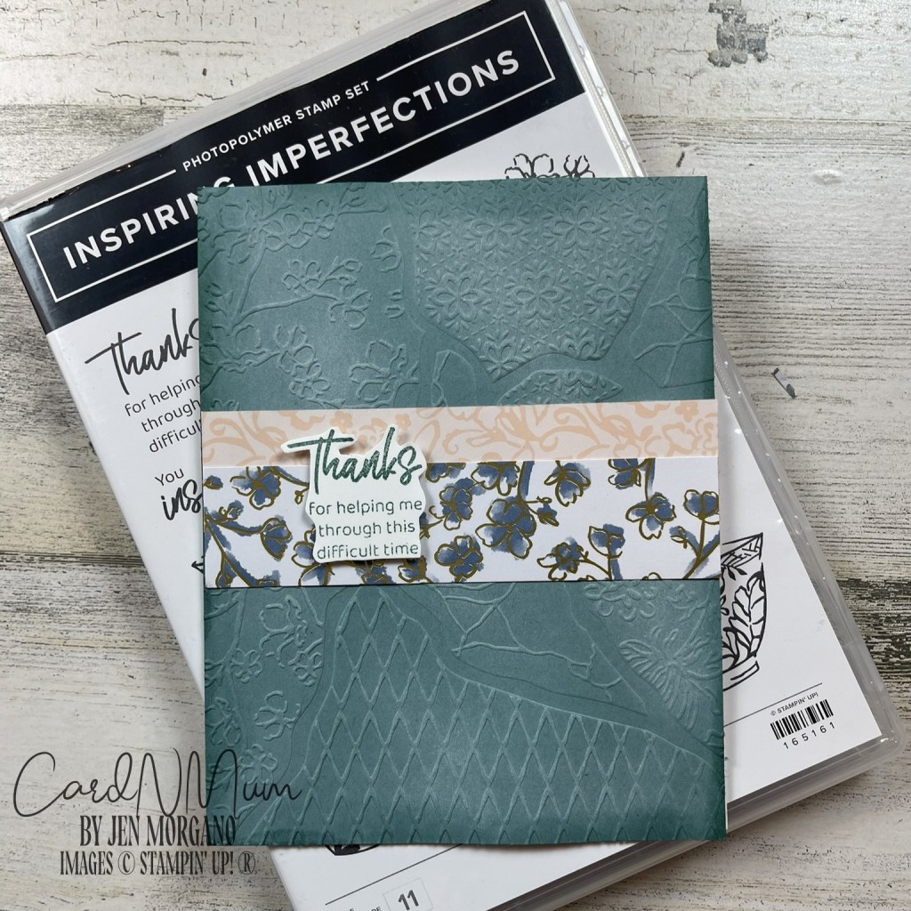 A thank you card with an embossed teal cover and floral design, placed on a background featuring a stamp set named 'Inspiring Imperfections'.