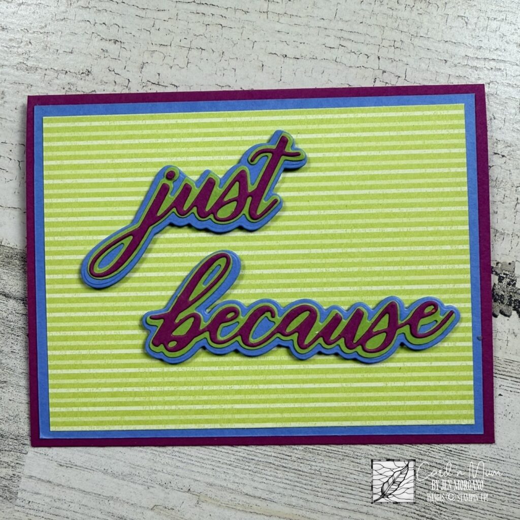Stampin’ Up! handmade card featuring layered die-cut “just because” sentiment in bright cardstock on a striped background, perfect for bold and colorful cardmaking inspiration.