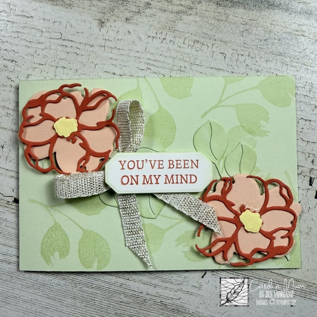 Handmade Stampin’ Up! card featuring the Petals of Beauty bundle with die-cut floral elements, soft green stamped background, ribbon detail, and “You’ve been on my mind” sentiment